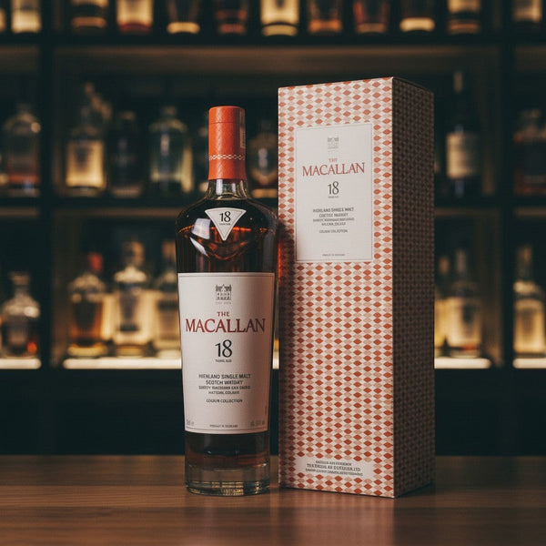 Whiskyquartier Macallan 18 Years Old Colour Collection, bernsteinfarbener Single Malt Scotch Whisky in Glasflasche mit orangefarbener Geschenkbox.